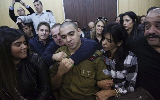 IDF Sgt. Elor Azaria, the Israeli soldier, who shot a Palestinian attacker in Hebron surrounded by family and supports as he arrives to hear his verdict in a courtroom at the Kirya military base, Tel Aviv, January 4, 2017. (Miriam Alster/Flash90) IDF Sgt. Elor Azaria, the Israeli soldier, who shot a Palestinian attacker in Hebron surrounded by family and supports as he arrives to hear his verdict in a courtroom at the Kirya military base, Tel Aviv, January 4, 2017. (Miriam Alster/Flash90)