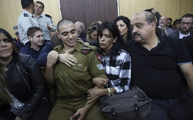 Elor Azaria, an Israeli soldier who shot a Palestinian terrorist in Hebron, sits in the courtroom before the announcement of his verdict at the Kirya military base in Tel Aviv on Wednesday, January 4, 2017 (Miriam Alster/Flash90) 
