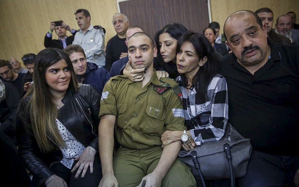 Elor Azaria, an Israeli soldier who shot a Palestinian terrorist in Hebron, sits in the courtroom before the announcement of his verdict at the Kirya military base in Tel Aviv on Wednesday, January 4, 2017 (Miriam Alster/Flash90)