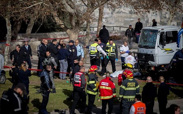 The scene of a truck-ramming attack in which a truck plowed into a group of Israeli soldiers, killing four and injuring 16, in the Armon Hanatsiv neighborhood of Jerusalem. January 08, 2017. (Yonatan Sindel/Flash90)