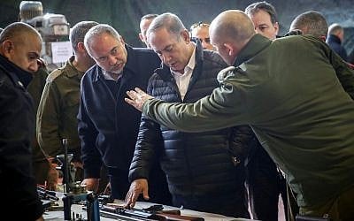 Prime Minister Benjamin Netanyahu and Defense Minister Avigdor Liberman visit the headquarters of the IDF's Judea and Samaria Division, near the Israeli settlement of Beit El in the West Bank. January 10, 2017. (Hadas Parush/Flash90)