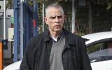 Publisher and owner of the Yedioth Ahronoth newspaper Arnon 'Noni' Mozes arrives for questioning at the Lahav 433 investigation unit in Lod, January 15, 2017. (Koko/Flash90)