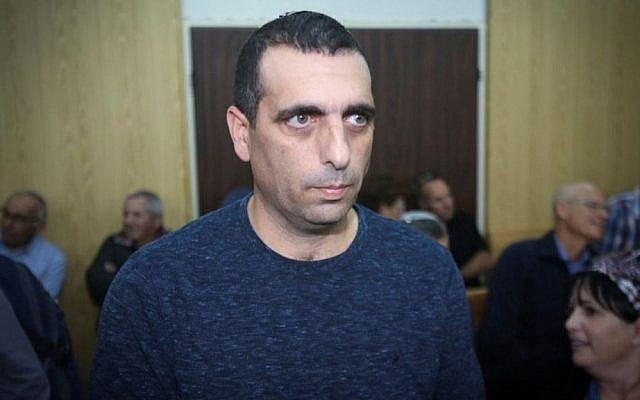 Ofek Buchris, a former IDF general accused of rape and other sexual crimes against subordinates, arrives with his wife Naama, to the Jaffa military court on January 17, 2017. (Flash90) Ofek Buchris, a former IDF general accused of rape and other sexual crimes against subordinates, arrives with his wife Naama, to the Jaffa military court on January 17, 2017. (Flash90)