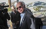 Amos Regev, then-editor in chief of the Israel Hayom daily, arrives for questioning in 'Case 2000' at the Israel Police's Lahav 433 corruption investigation unit in Lod, January 17, 2017. (Roy Alima/Flash90)