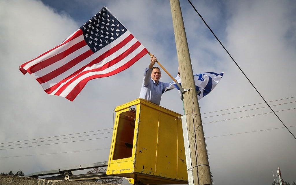 An official from Gush Etzion Regional Council hangs a US flag from a lamppost a day before the inauguration of Donald Trump as president, on January 19, 2017 (Photo by Gershon Elinson/Flash90) An official from Gush Etzion Regional Council hangs a US flag from a lamppost a day before the inauguration of Donald Trump as president, on January 19, 2017 (Photo by Gershon Elinson/Flash90)