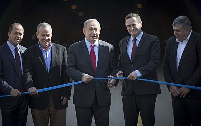 Prime Minister Benjamin Netanyahu (C) and Transportation Minister Yisrael Katz (2R) attend an opening ceremony for the new Harel tunnels on the main Tel Aviv-Jerusalem highway on January 19, 2017. (Photo by Yonatan Sindel/Flash90) Prime Minister Benjamin Netanyahu (C) and Transportation Minister Yisrael Katz (2R) attend an opening ceremony for the new Harel tunnels on the main Tel Aviv-Jerusalem highway on January 19, 2017. (Photo by Yonatan Sindel/Flash90)