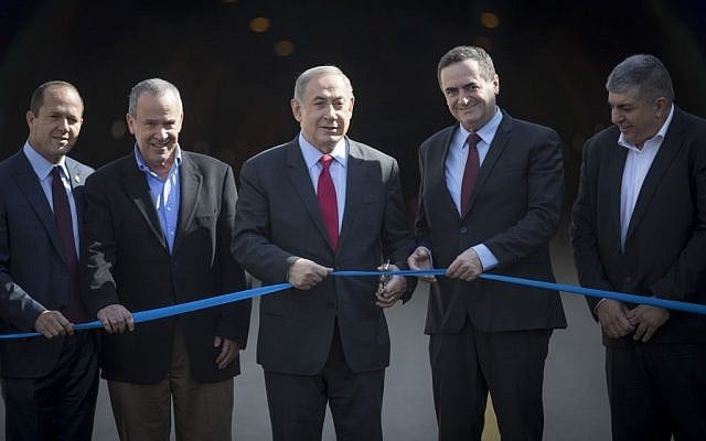 Prime Minister Benjamin Netanyahu (C) and Transportation Minister Yisrael Katz (2R) attend an opening ceremony for the new Harel tunnels on the main Tel Aviv-Jerusalem highway on January 19, 2017. (Photo by Yonatan Sindel/Flash90) Prime Minister Benjamin Netanyahu (C) and Transportation Minister Yisrael Katz (2R) attend an opening ceremony for the new Harel tunnels on the main Tel Aviv-Jerusalem highway on January 19, 2017. (Photo by Yonatan Sindel/Flash90)