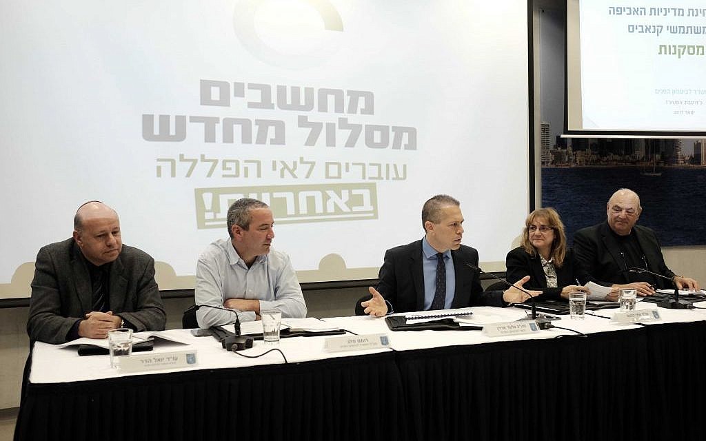 Public Security Minister Gilad Erdan (C) holds a press conference in Tel Aviv to announce his support for a new marijuana policy on January 26, 2017 (Photo by Tomer Neuberg/Flash90)