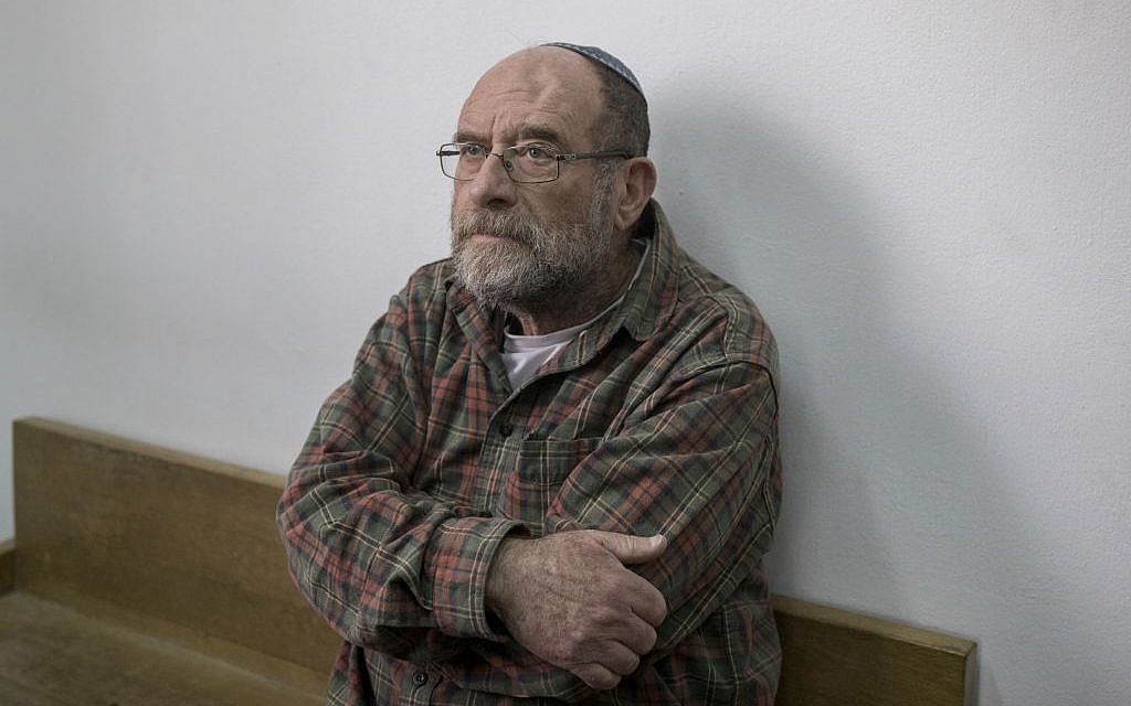 Yossi Barkan, the exterminator who left the poison that led to the deaths of young sisters Avigail and Yael Gross attends a court hearing in Jerusalem District Court on January 26, 2017. (Photo by Yonatan Sindel/Flash90)