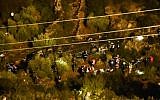 Israeli rescue forces and security forces at the scene where a bus flipped over, near Ma'ale Levonah in the West Bank, on January 27, 2017 (Moshe Mizrachi/Flash90)
