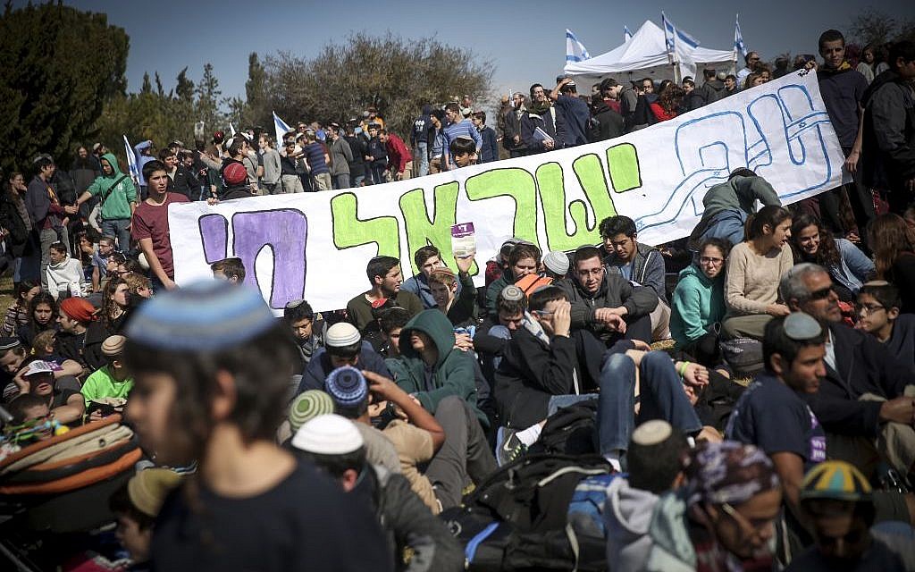 Israeli settlers protest the planned eviction of the Amona outpost, in front of the Knesset, January 30, 2017. (Hadas Parush/Flash90)