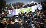 Israeli settlers protest the planned eviction of the Amona outpost, in front of the Knesset, January 30, 2017. (Hadas Parush/Flash90)