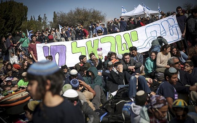 Israeli settlers protest the planned eviction of the Amona outpost, in front of the Knesset, January 30, 2017. (Hadas Parush/Flash90)