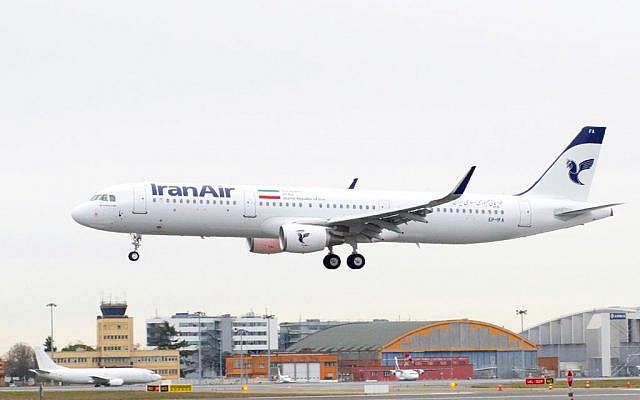 In this photo dated Wednesday, Jan. 11, 2016, provided by Airbus, shows an A321 with the Iran Air logo landing at Blagnac airport near Toulouse, southwestern France. Iran Air has taken delivery of its first new aircraft, an A321, in a hand over ceremony in Toulouse. (Herve Gousse/Airbus via AP)