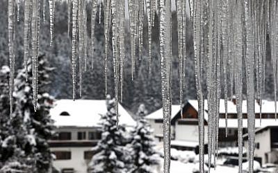 Icicles hang from a roof of a house in Oberstdorf, southern Germany, Sunday Jan. 8, 2017. Karl-Josef Hildenbrand/dpa via AP)