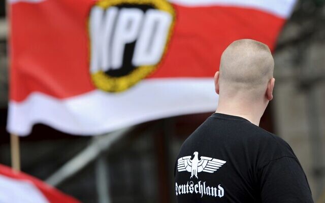 In this June 17, 2012, photo, a supporter of the National Democratic Party, NPD, attends a rally in Berlin (Matthias Balk/dpa via AP,file) In this June 17, 2012, photo, a supporter of the National Democratic Party, NPD, attends a rally in Berlin (Matthias Balk/dpa via AP,file)