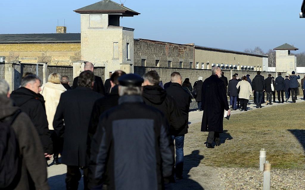 Visitors walk at the Sachsenhausen concentration camp memorial in Oranienburg, Germany, Friday, Jan. 27, 2017 on the Holocaust Remembrance Day. (Maurizio Gambarini/dpa via AP)