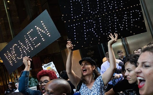 A group of protestors, comprised mostly of women, rally against Republican presidential candidate Donald Trump outside of Trump Tower, November 3, 2016 in New York City.(Drew Angerer/Getty Images) A group of protestors, comprised mostly of women, rally against Republican presidential candidate Donald Trump outside of Trump Tower, November 3, 2016 in New York City.(Drew Angerer/Getty Images)