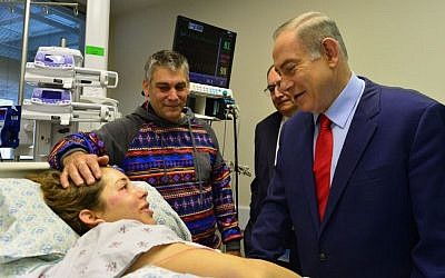 Prime Minister Benjamin Netanyahu visits an IDF solider injured in a truck-ramming attack at the Hadassah Medical Center in Ein Kerem, Jerusalem on January 9, 2017. (Kobi Gidon, GPO) Prime Minister Benjamin Netanyahu visits an IDF solider injured in a truck-ramming attack at the Hadassah Medical Center in Ein Kerem, Jerusalem on January 9, 2017. (Kobi Gidon, GPO)
