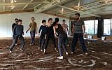 Eight members of modern dance troupe Vertigo show part of their newest piece, 'One. One and One," created in celebration of the group's 25th anniversary celebration (Jessica Steinberg/Times of Israel)