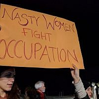 Many signs and chants at the women‘s march in Tel Aviv on January 21, 2017 had left-wing slogans advocating for Palestinian rights in addition to women‘s rights. (Melanie Lidman/Times of Israel)