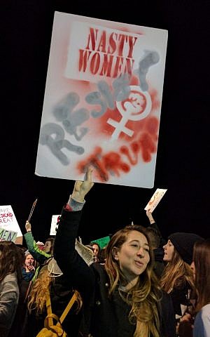 "Trump, Trump, bist a shrek, Donald Trump gay avek!" is Yiddish for "Donald Trump, you‘re a terror, Donald Trump go away!" one of the chants heard in the crowd on January 21, 2017 at the Tel Aviv women‘s march. (Melanie Lidman/Times of Israel)