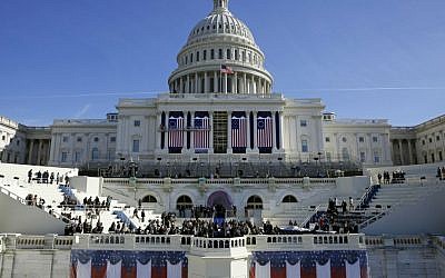 In this Jan. 15, 2016, photo, the US Capitol frames the backdrop over the stage during a rehearsal of President-elect Donald Trump's swearing-in ceremony in Washington. (AP Photo/Patrick Semansky)