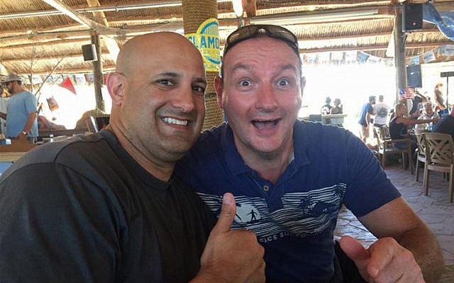 Screen grab of a photo from a Facebook posting, showing Col. Victor Garcia, left, who served as the senior officer overseeing CENTCOM’s counter-propaganda program from 2013 to mid-2016, posing on vacation with his friend Simon Bergman at Gilbert’s Resort in Key Largo, Fla. (AP Photo) 