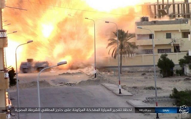 This photo posted on a file sharing website Wednesday, Jan. 11, 2017, by the Islamic State Group in Sinai, a terrorist organization, shows an explosion as terrorists attack an Egyptian police checkpoint on Monday, Jan. 9, 2017, in el-Arish, north Sinai, Egypt. (Islamic State Group in Sinai, via AP)