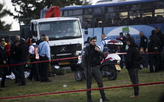Israeli police at the scene of a terror attack in Jerusalem Sunday, Jan. 8, 2017. A Palestinian rammed his truck into a group of Israeli soldiers, killing four and wounding 16 others (AP Photo/Mahmoud Illean)