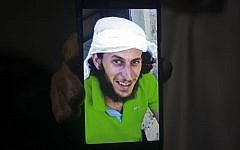 A relative shows a mobile phone photo of Fadi Qunbar, 28, outside his home in Jerusalem, Sunday, Jan. 8, 2017. Qunbar was identified as the terrorist who drove a truck into a group of Israeli soldiers, killing four and wounding 16 (AP Photo/Mahmoud Illean)