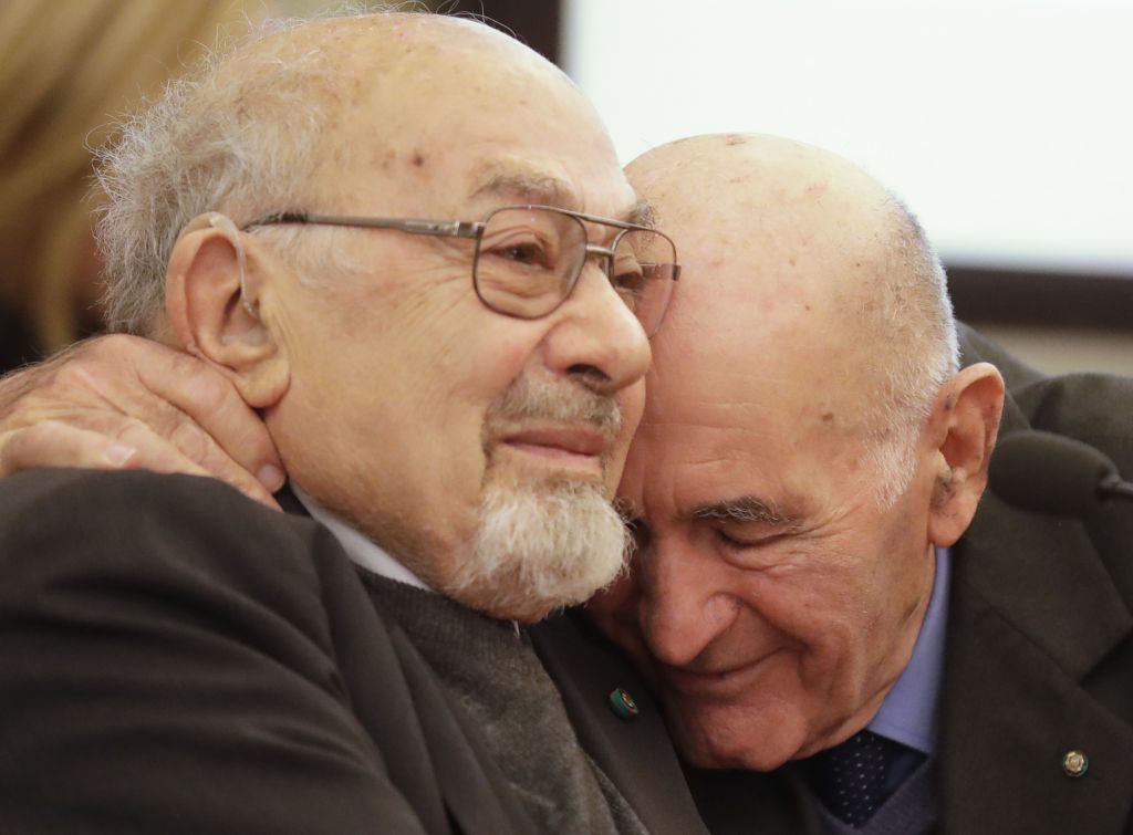 Holocaust survivors Sami Modiano, right, and Piero Terracina hug each other during an event on International Holocaust Remembrance Day, at Rome's Capitol Hill, Friday, Jan. 27, 2017. (AP Photo/Alessandra Tarantino) Holocaust survivors Sami Modiano, right, and Piero Terracina hug each other during an event on International Holocaust Remembrance Day, at Rome's Capitol Hill, Friday, Jan. 27, 2017. (AP Photo/Alessandra Tarantino)