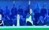 Screen capture from video showing actress Asta Baukute, a former lawmaker, gives a Nazi-style salute on the Lithuanian 'Guess the Melody' game show, January 2017. (YouTube/Manciusz)