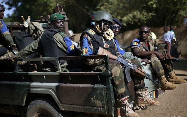 In this file photo taken on Sunday Nov. 24, 2013, the Malian army patrol the streets of Gao, Northern Mali. (AP Photo/Jerome Delay, File) In this file photo taken on Sunday Nov. 24, 2013, the Malian army patrol the streets of Gao, Northern Mali. (AP Photo/Jerome Delay, File)