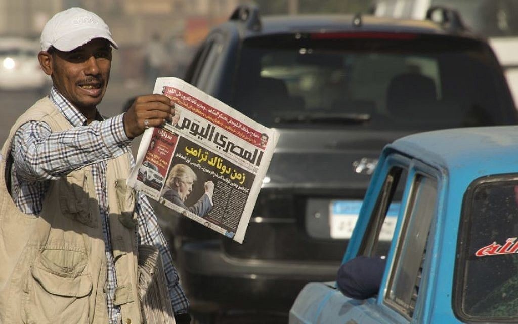 An Egyptian newspaper vendor holds copies of local newspapers fronted with a picture of President-elect Donald Trump with Arabic headline that reads, "Trump era", November 10, 2016. (AP Photo/Amr Nabil, File) An Egyptian newspaper vendor holds copies of local newspapers fronted with a picture of President-elect Donald Trump with Arabic headline that reads, "Trump era", November 10, 2016. (AP Photo/Amr Nabil, File)