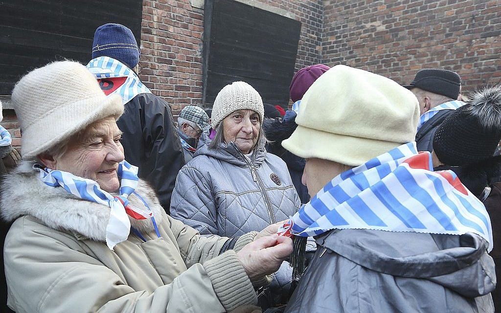 Holocaust survivors commemorate people killed by the Nazis at the Auschwitz Nazi death camp in Oswiecim, Poland, Friday, Jan. 27, 2017, on the International Holocaust Remembrance Day that marks the liberation of the Auschwitz Nazi death camp on Jan. 27, 1945. (AP Photo/Czarek Sokolowski)