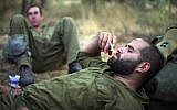 Israeli soldiers smoking during training in northern Israel, June 14, 2009. (Matanya Tausig/Flash90)