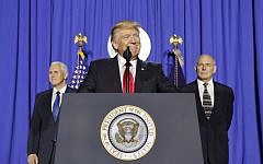 President Donald Trump, accompanied by Vice President Mike Pence, left, and Homeland Security Secretary John F. Kelly, speaking at the Homeland Security Department in Washington, January 25, 2017. (AP Photo/Pablo Martinez Monsivais)