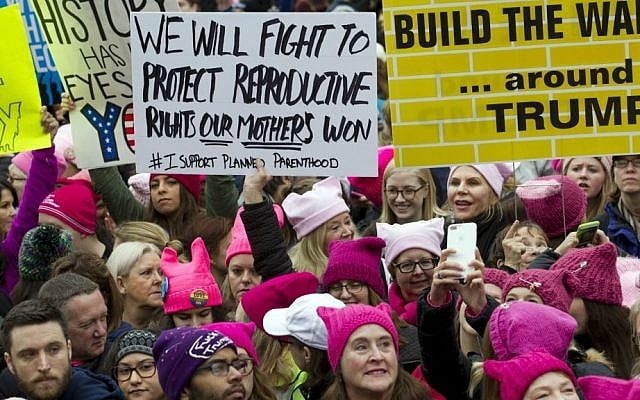 Women with bright pink hats and signs gather to make their voices heard on the first full day of Donald Trump's presidency, Saturday, Jan. 21, 2017 in Washington. (AP Photo/Jose Luis Magana) Women with bright pink hats and signs gather to make their voices heard on the first full day of Donald Trump's presidency, Saturday, Jan. 21, 2017 in Washington. (AP Photo/Jose Luis Magana)