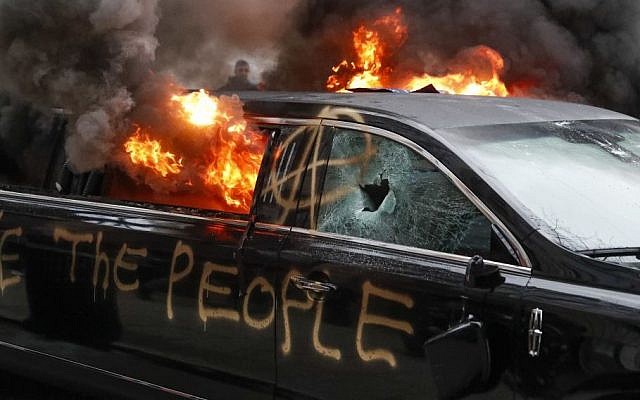 A parked limousine burns during a demonstration after the inauguration of President Donald Trump, Friday, Jan. 20, 2017, in Washington. (AP/John Minchillo) A parked limousine burns during a demonstration after the inauguration of President Donald Trump, Friday, Jan. 20, 2017, in Washington. (AP/John Minchillo)