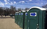 A row of portable restrooms, with the name “Don’s Johns” covered up, is seen on Capitol Hill in Washington, Friday, Jan. 13, 2017 (AP Photo/Matthew Daly)