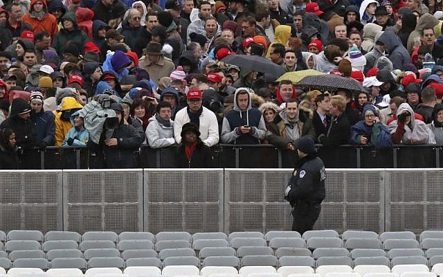 A Capitol Hill police officer watches the crowd before the swearing in of Donald Trump as the 45th president of the United States during the 58th Presidential Inauguration at the US Capitol in Washington. Friday, Jan. 20, 2017 (Andrew Harnik/AP)