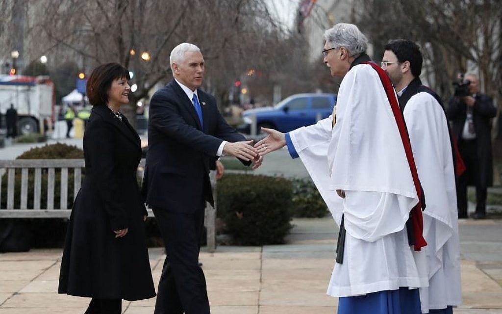 Rev. Luis Leon greets Vice President-elect Mike Pence and his wife Karen as they arrive for a church service at St. John’s Episcopal Church across from the White House in Washington, Friday, Jan. 20, 2017, on Donald Trump's inauguration day. (AP Photo/Alex Brandon)