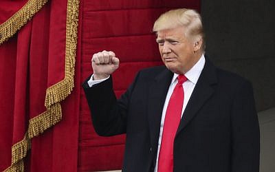 President-elect Donald Trump pumps his fist as he arrives for the 58th Presidential Inauguration at the U.S. Capitol in Washington, Friday, Jan. 20, 2017. (AP Photo/Andrew Harnik)