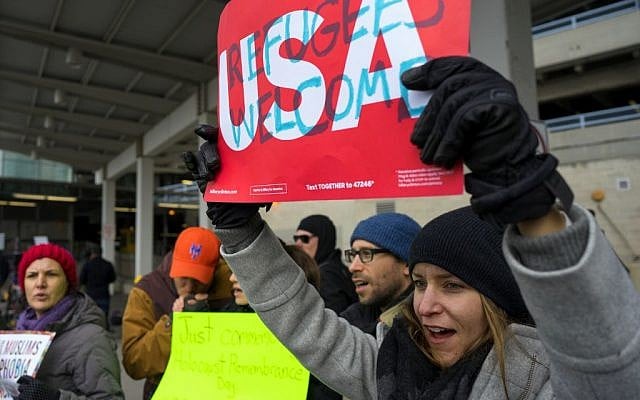 After two Iraqi refugees were detained while trying to enter the country, protesters assemble at John F. Kennedy International Airport in New York, January 28, 2017. (AP/Craig Ruttle) After two Iraqi refugees were detained while trying to enter the country, protesters assemble at John F. Kennedy International Airport in New York, January 28, 2017. (AP/Craig Ruttle)