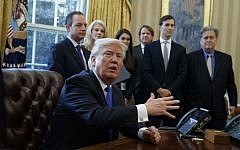 President Donald Trump talks with reporters in the Oval Office of the White House in Washington, Tuesday, Jan. 24, 2017, before signing an executive order on the Keystone XL pipeline. (AP/Evan Vucci)