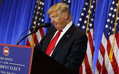President-elect Donald Trump pauses during a news conference in the lobby of Trump Tower in New York, Wednesday, Jan. 11, 2017. (AP Photo/Evan Vucci)
