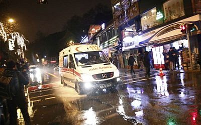An ambulance rushes from the scene of a reported terror attack in Istanbul, early Sunday, Jan. 1, 2017. (AP Photo/Halit Onur Sandal)