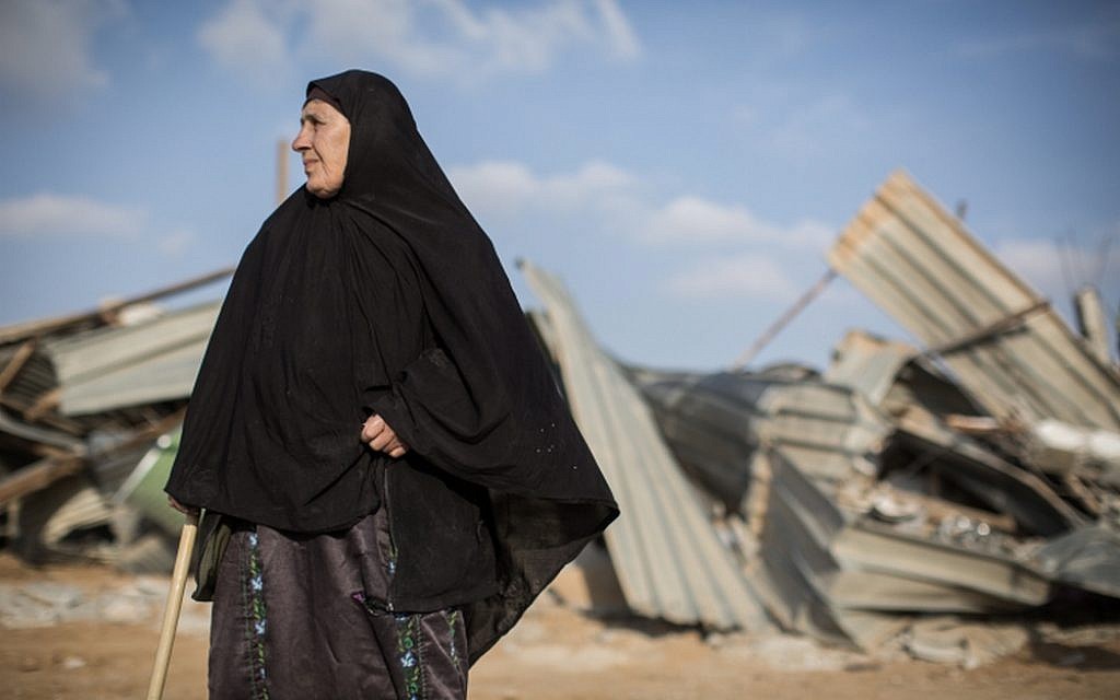 A Bedouin woman reacts after seeing her demolished home in the Bedouin village of Umm al-Hiran in the Negev Desert, in southern Israel, January 18, 2017. (Hadas Parush/Flash90) A Bedouin woman reacts after seeing her demolished home in the Bedouin village of Umm al-Hiran in the Negev Desert, in southern Israel, January 18, 2017. (Hadas Parush/Flash90)