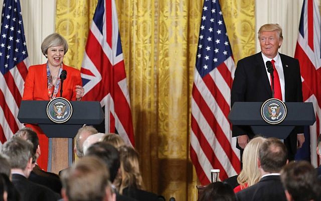 President Donald Trump and British Prime Minister Theresa May react to a question from a member of the media during their joint news conference in the East Room of the White House White House in Washington, Friday, Jan. 27, 2017. (Pablo Martinez Monsivais/AP) 